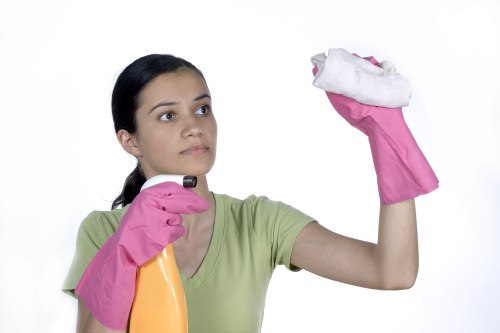 Team member completing a carpet cleaning task with safety precautions